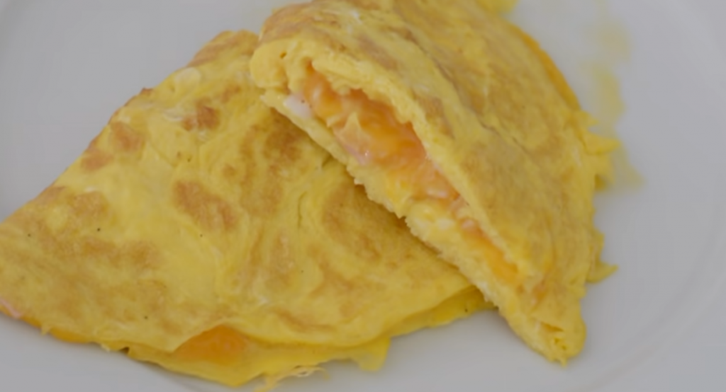 Omelets filled with cheddar cheese